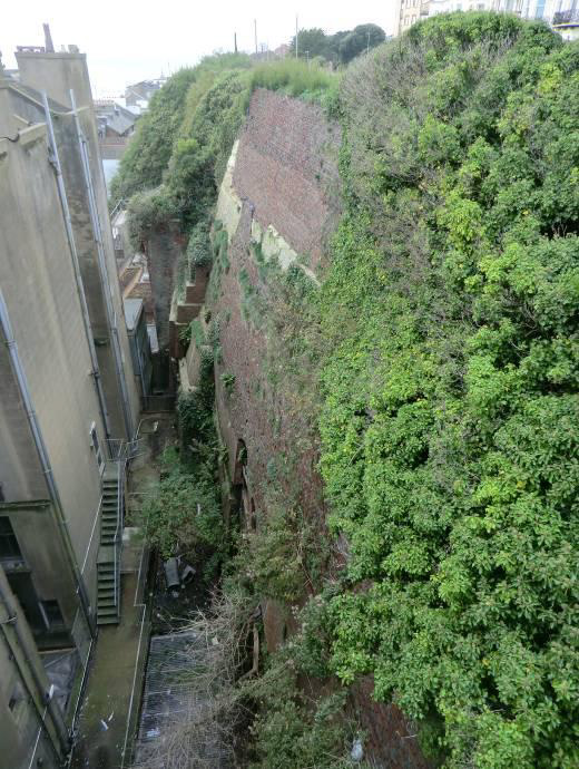 The bricked cliffs behind Palace Chambers